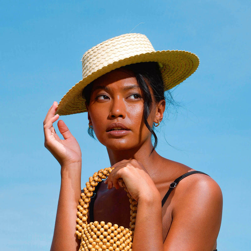 Celeste Woven Straw Hat is designed with thoughtful functionality and high-quality palm straw material sourced locally from Bali villages. This lightweight hat is thoughtfully woven by skilled artisans from remote villages is Bali who are mostly women. It is such a timeless piece, with just the right amount of personality.