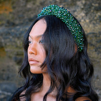 Take your look to the next level with BrunnaCo's exquisite CROWN Glass Crystal Headband. This stunning accessory features a lush emerald green color that adds a touch of sophistication to any outfit. The intricate arrangement of faceted glass beads catches the light and sparkles with every movement, making it the perfect finishing touch for any special occasion.