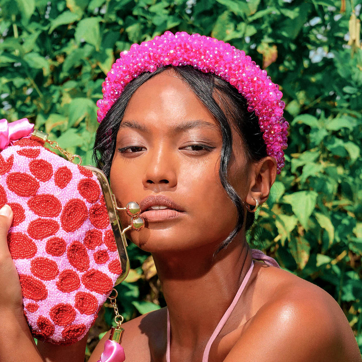 Add a touch of sparkle to your look with BrunnaCo’s  dazzling CROWN Glass Headband in hot pink color. The intricate glass beads arrangement catches the eye and sparkles with every movement, making it the perfect finishing touch for any special occasion.