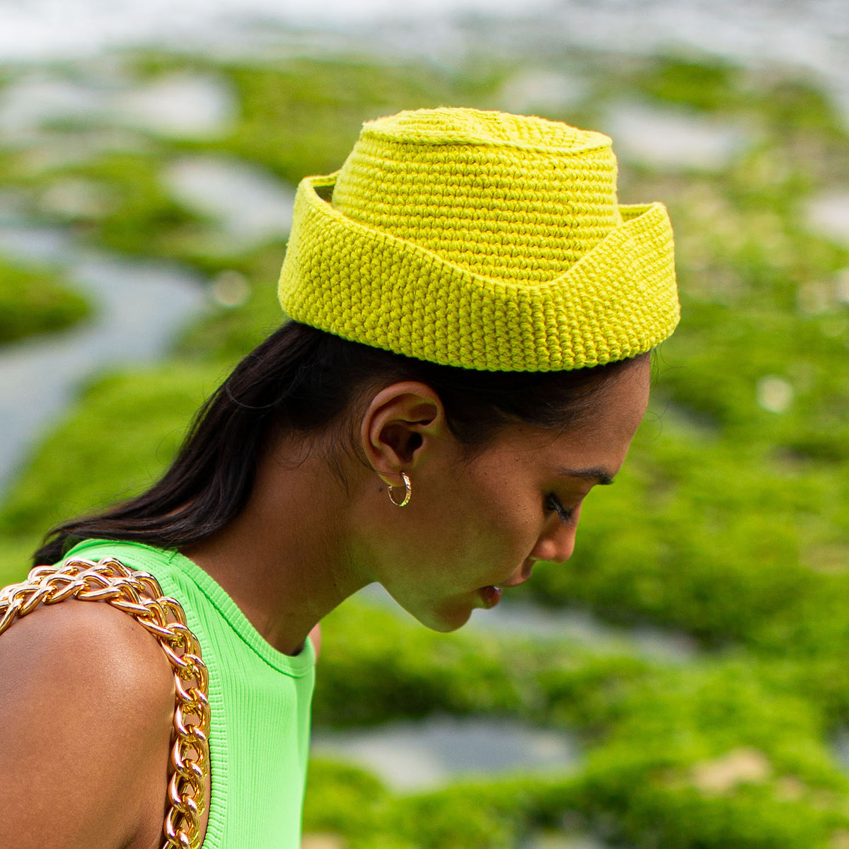 Gani hat in neon green is hand-crocheted in breathable cotton yarn by our local artisans in Java island. Featuring a modern twist of the cloche hat shape, this hat has sturdy textures and fluid proportions. Fold the brim part to shape it into a sailor hat style.