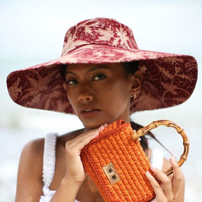 Sustainable Handpainted Javanese Batik Floral Wide-brim Hat For Beach, Pool, and Vacation In Maroon Red and Pink