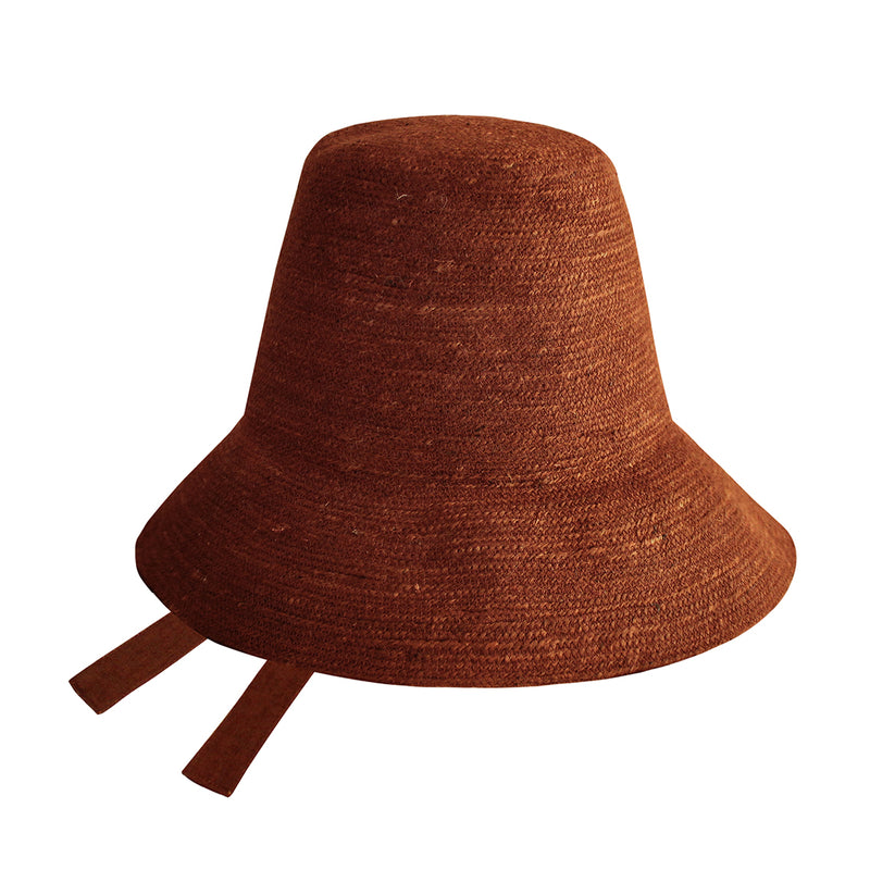 Meg Jute Straw Beach Hat in Burnt Sienna. Beautifully crafted with a tall crown shape and medium-width brim to bring back the effortless classic charm. Take this hat to your next outdoor adventure or simply style up your daily grocery shop trips!