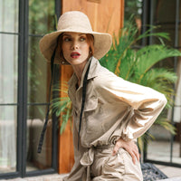 Meg Jute Straw Hat in Beige. Beautifully crafted with a tall crown shape and medium-width brim to bring back the effortless classic charm. Take this hat to your next outdoor adventure or simply to style up your daily grocery shop trips!