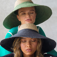 Duo color tone handwoven beach straw hat in natural and black brim color, handmade from natural jute straw by local artisan in Bali. Handmade vacation wide-brim hat with domed down brim for maximum sun protection. Sustainably made by female artisan community in Indonesia for resort vacation season.