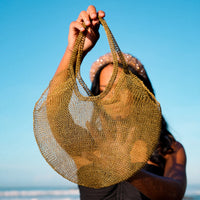 BrunnaCo Artisanan SOL Wire Tote Beach Bag in Dark Gold. Precious handwoven tote bag made from stainless metal wire. Made carefully by our artisans in remote villages in Bali, who create the bags from their very own homes. It is a true masterpiece.