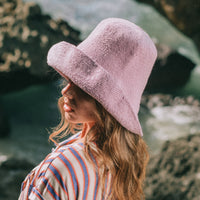 BrunnaCo Bloom Crochet hat in Lilac Purple. Soft and shapeable crochet hat inspired by the classic Calla Lily flower shape. Meticulously made by artisans in the villages of Bali. Its light and semi-floppy construction makes it the perfect hat for picnics at the beach or poolside any season of the year.