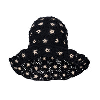 Flora Crochet Hat in Black. This gorgeous crochet hat made from 100% cotton yarn, complete with an eye-catching flower pattern, is designed to give you a fun and feminine fit.  A must-have collection for creating a cute and casual look. Hand-crocheted with love by our female artisans from their very own home in Bali.