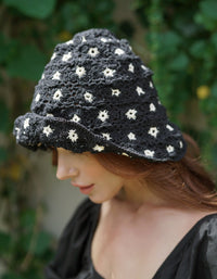 Flora Crochet Hat in Black. This gorgeous crochet hat made from 100% cotton yarn, complete with an eye-catching flower pattern, is designed to give you a fun and feminine fit.  A must-have collection for creating a cute and casual look. Hand-crocheted with love by our female artisans from their very own home in Bali.