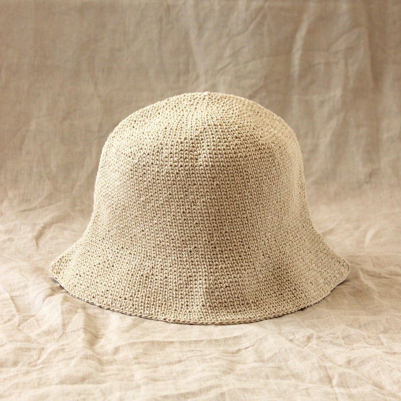 Florette Crochet Bucket Beach Hat In White. Soft and shapeable crochet bucket hat meticulously made by artisans in the villages of Bali. This hat feels airy for summer days and offers irreplaceable comfort at any season of the year.