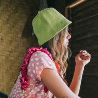 Florette Crochet Bucket Clochet hat in Lime Green. Soft and shapeable crochet bucket hat meticulously made by artisans in the villages of Bali. This hat feels airy for summer days and offers irreplaceable comfort at any season of the year.