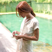 The Lana linen shirt is a versatile and timeless piece that seamlessly blends the relaxed and carefree styles of Bali and California. Made from premium quality linen, this shirt offers a luxurious and comfortable wear that's perfect for any season. The natural fabric is lightweight and breathable, providing a cool and airy feel against the skin, while also being durable and long-lasting.