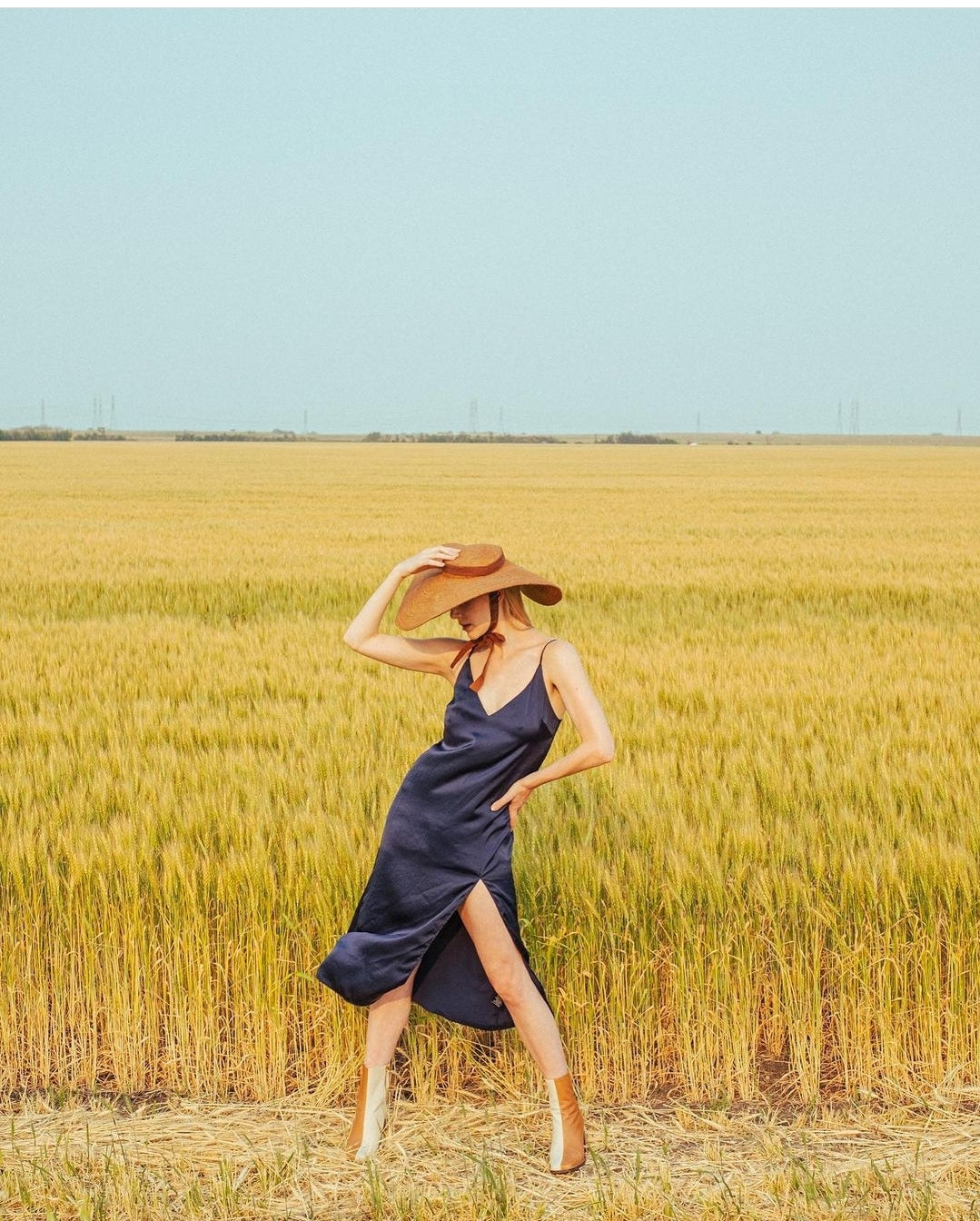 Lola Wide Brim Jute Straw Hat In Havana Brown. Braided meticulously by artisans in Gianyar, Bali from natural Jute material, this sweet hat offers both comfort and elegance. Designed with ideal thickness and weight that allow its brim to be easily folded, stretched, and styled, making it easy to take to any holiday trips or summer vacation.