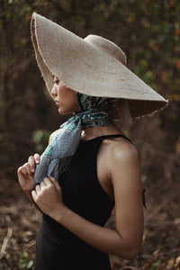 Lola Wide Brim Jute Straw Hat In Natural Beige. This sun hat is hand-weaved meticulously by women artisans in Gianyar, Bali from natural Jute material, this sweet hat offers both comfort and elegance. Designed with ideal thickness and weight that allow its brim to be easily folded, stretched, and styled, making it easy to take to any holiday trip. 