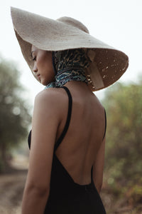 Lola Wide Brim Jute Straw Hat In Natural Beige. This sun hat is hand-weaved meticulously by women artisans in Gianyar, Bali from natural Jute material, this sweet hat offers both comfort and elegance. Designed with ideal thickness and weight that allow its brim to be easily folded, stretched, and styled, making it easy to take to any holiday trip. 