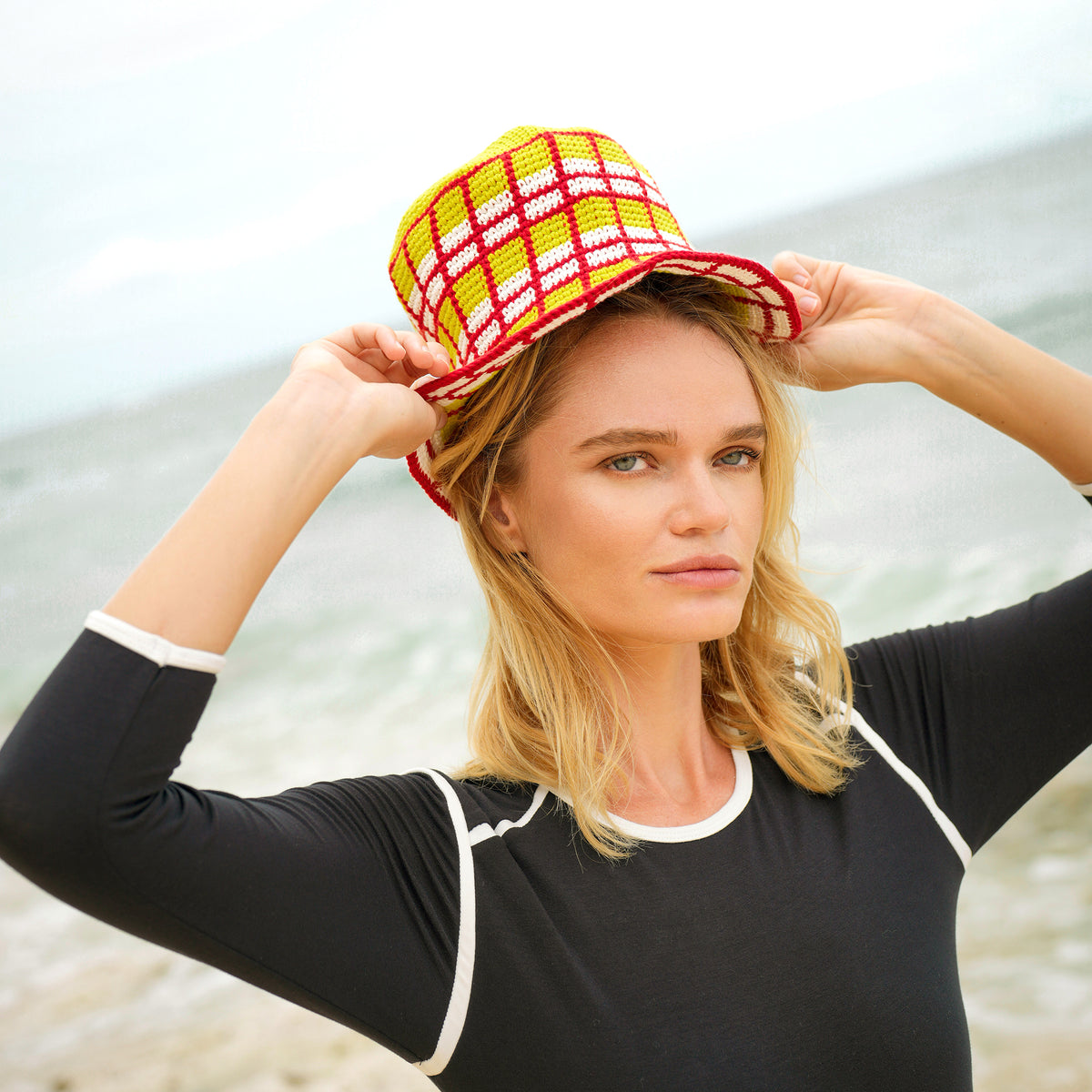 Margarita Plaid Crochet Hat. Hand-crocheted by female artisans in Java, Indonesia, this Margarita plaid crochet hat is a reminder of the beautiful feeling of being outdoor. Its fresh & tangy lime green and hot chili red color invite us to celebrate the seasons in the sun.