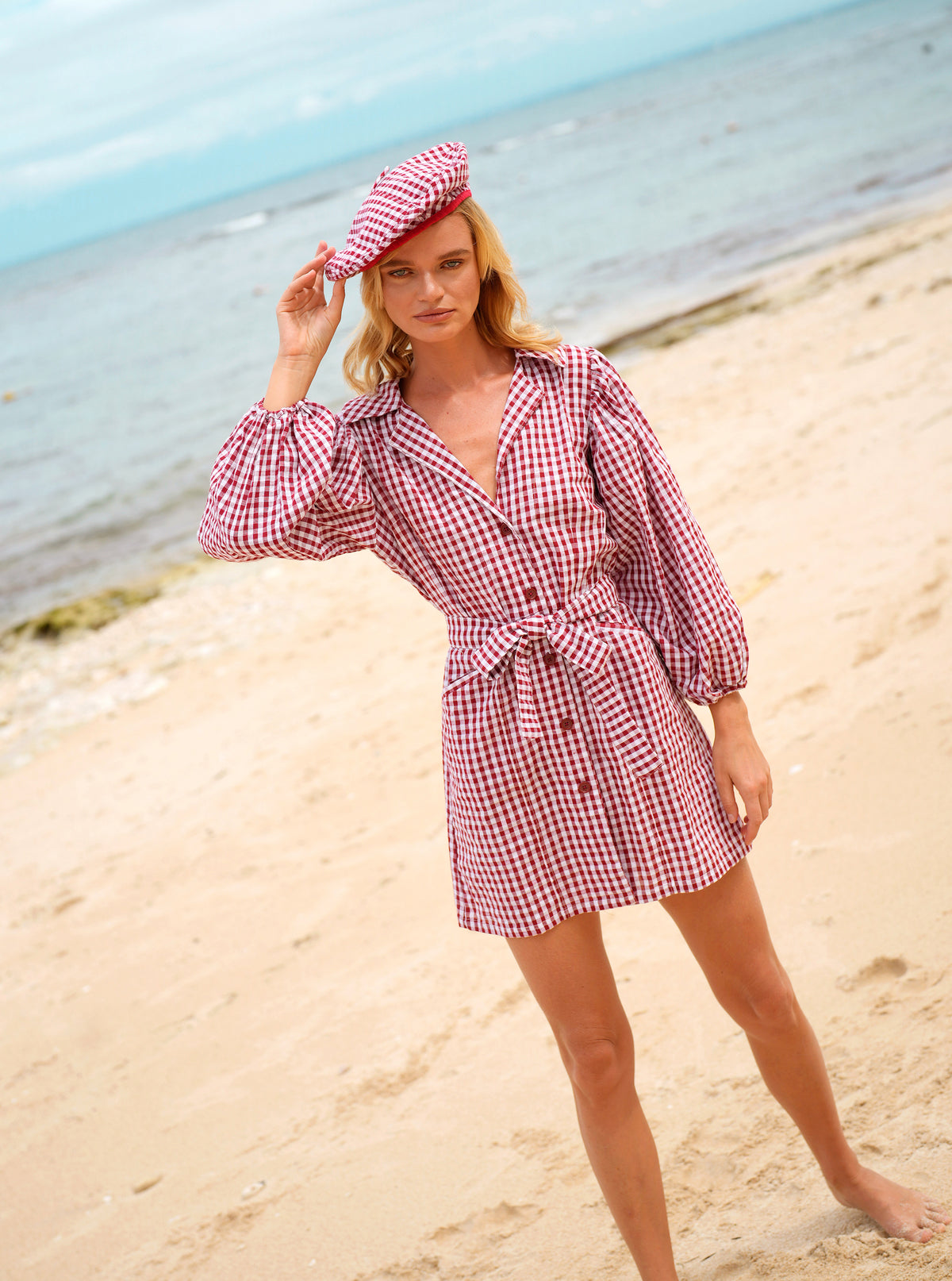 BrunnaCo Meghan Mini Gingham Dress in Red - A stylish and versatile dress that is perfect for any occasion. Made from high-quality materials, this dress is both comfortable and stylish. The flattering gingham pattern adds a touch of personality, while the red color is sure to turn heads. Whether you're dressing up for a night out or down for a day at the park, this dress is sure to become a staple in your wardrobe.