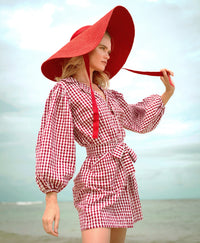 BrunnaCo Meghan Mini Gingham Dress in Red - A stylish and versatile dress that is perfect for any occasion. Made from high-quality materials, this dress is both comfortable and stylish. The flattering gingham pattern adds a touch of personality, while the red color is sure to turn heads. Whether you're dressing up for a night out or down for a day at the park, this dress is sure to become a staple in your wardrobe.