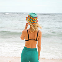 Poolside crochet plaid cotton bucket hat. Hand-crocheted by female artisans in Java, Indonesia, this POOLSIDE plaid crochet hat is a reminder of the beautiful feeling of being outdoors. Its fresh turquoise blue color invites us to celebrate the seasons in the sun.