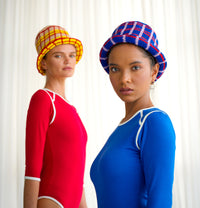 Sorority Plaid Crochet Hat. Hand-crocheted by female artisans in Java, Indonesia, SORORITY plaid crochet hat is a reminder of the beautiful feeling of being outdoors. Its fresh blue and energetic red color invites us to celebrate the seasons in the sun.