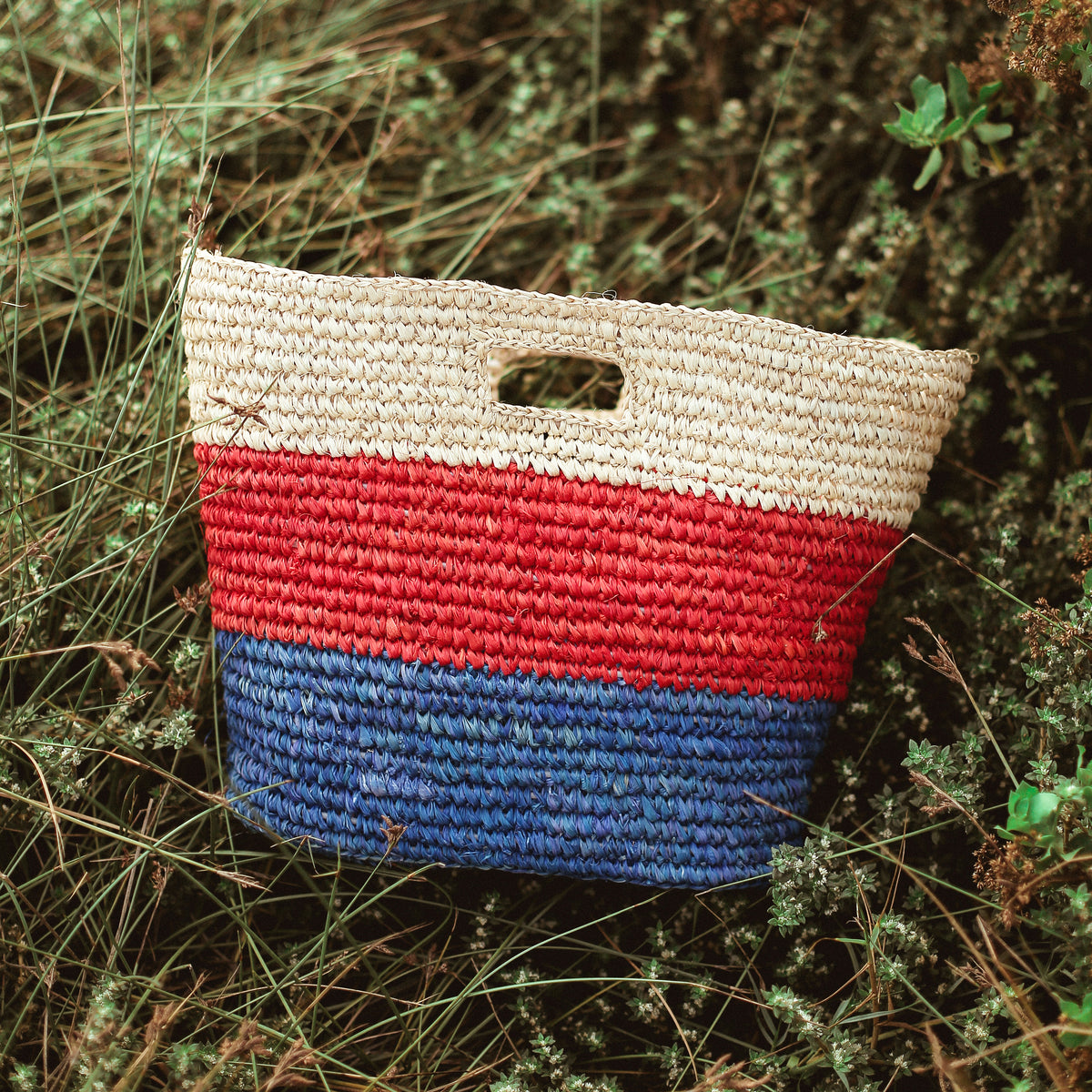 BrunnaCo Sayan Raffia Woven Straw Tote Bag in Red and Blue. A raffia beach tote that is perfect for any beach stroll or a casual walk to the nearest farmer's market