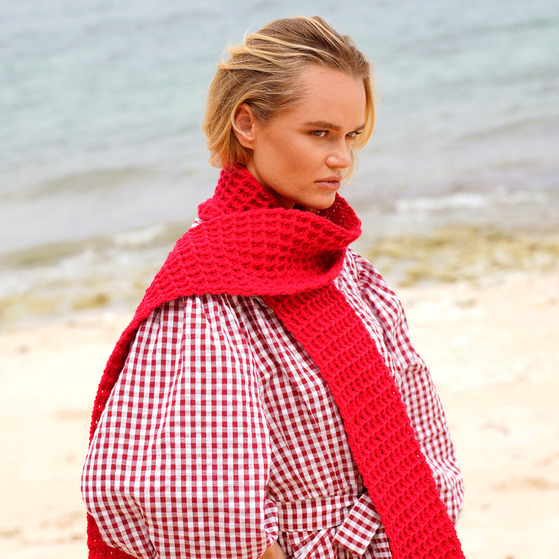 BrunnaCo's WAFFLE Crochet Scarf in Scarlet Red has a cozy and buttery-soft texture that makes you want to wear it everywhere when the temperature gets cold. It's hand-crocheted in waffle pattern with sumptuous cotton yarn by our female artisans in Java who put so much love into this piece. Wrap it around your neck twice or let it drape loosely over the lapels of your coat.