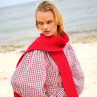 BrunnaCo's WAFFLE Crochet Scarf in Scarlet Red has a cozy and buttery-soft texture that makes you want to wear it everywhere when the temperature gets cold. It's hand-crocheted in waffle pattern with sumptuous cotton yarn by our female artisans in Java who put so much love into this piece. Wrap it around your neck twice or let it drape loosely over the lapels of your coat.